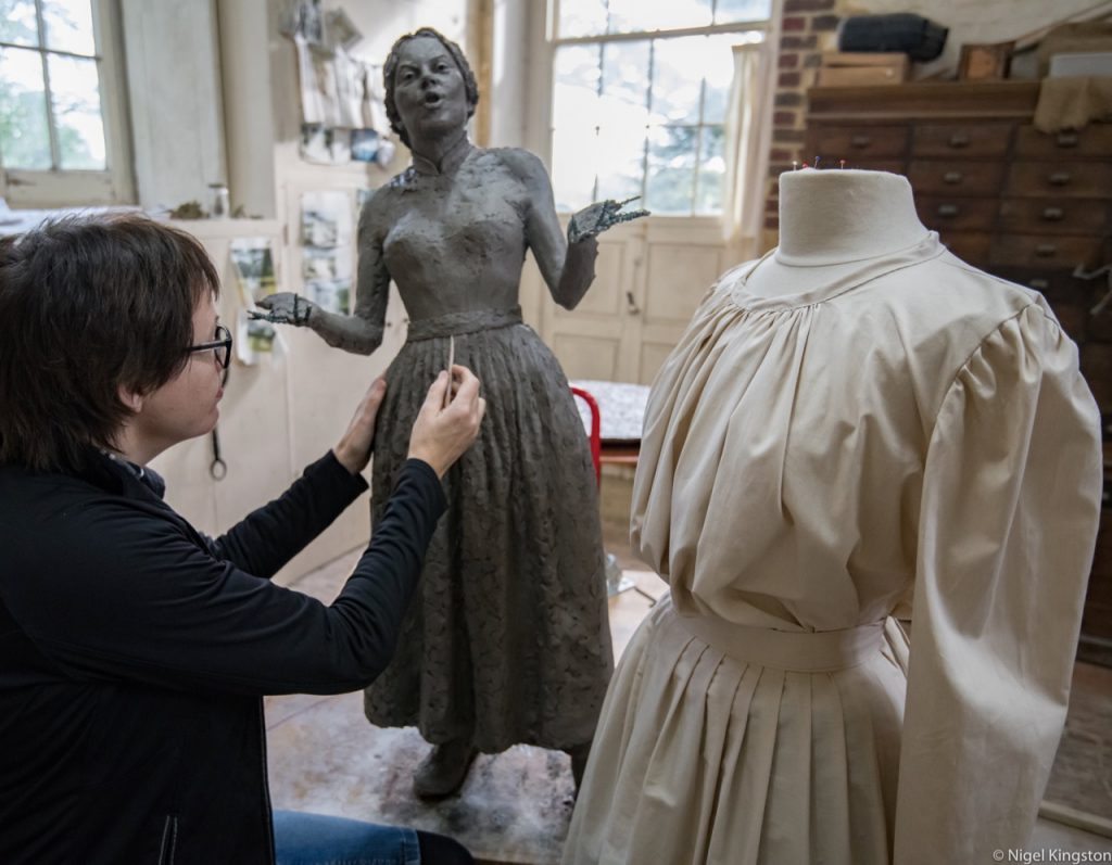 Hazel sculpting the costume on the Cracker Packer from the early 1900s