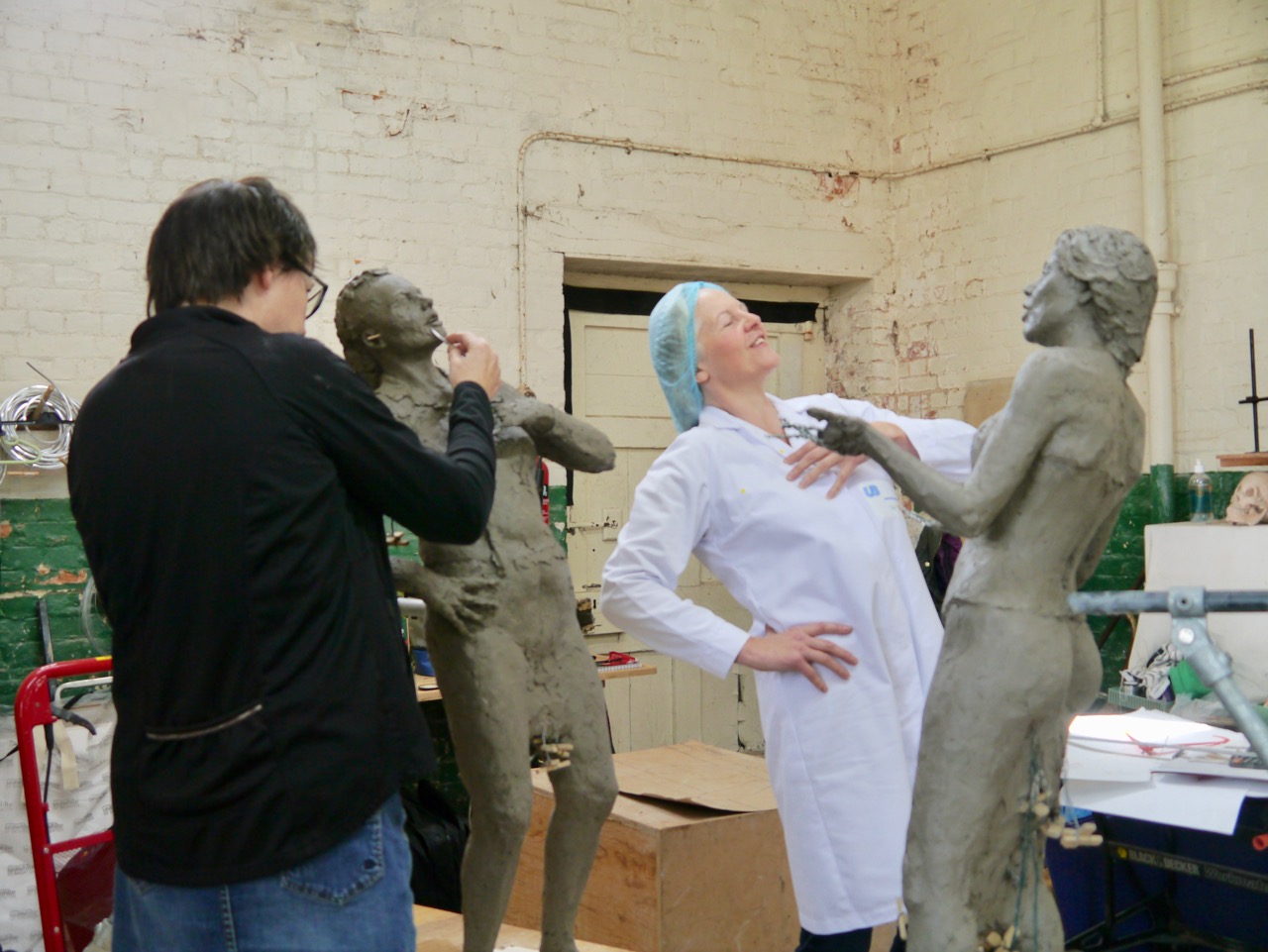 Hazel sculpts Sandra in the Housecoat uniform