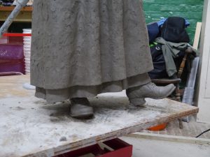 Long apron, underskirt and ankle-boots