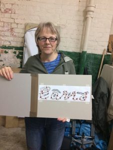 Sandra with her template for the Carr’s embossed logo | Hazel Reeves