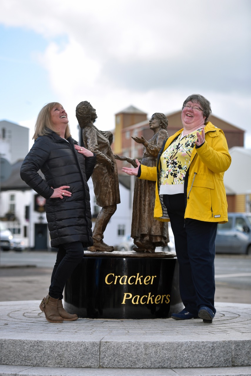 Dot Reynolds and Jane Davey from pladis adopt the pose that inspired the statue