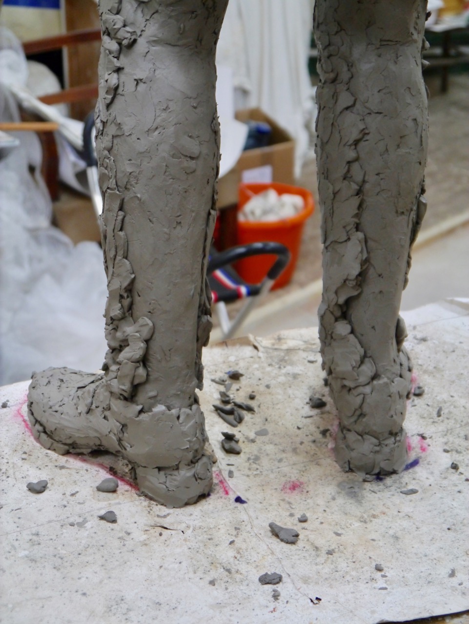 The trousers are sculpted over the legs