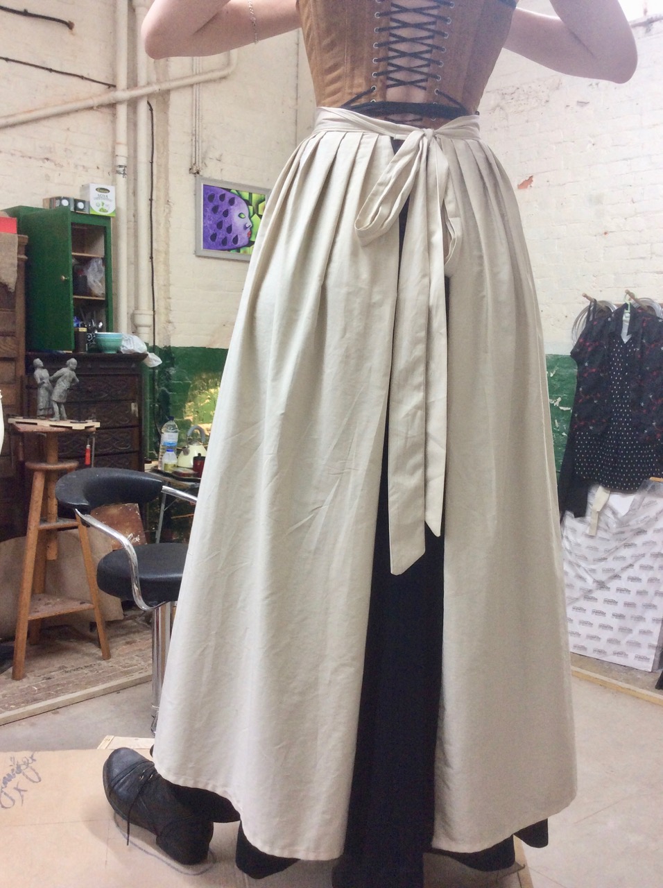 The wraparound apron and the skirt beneath