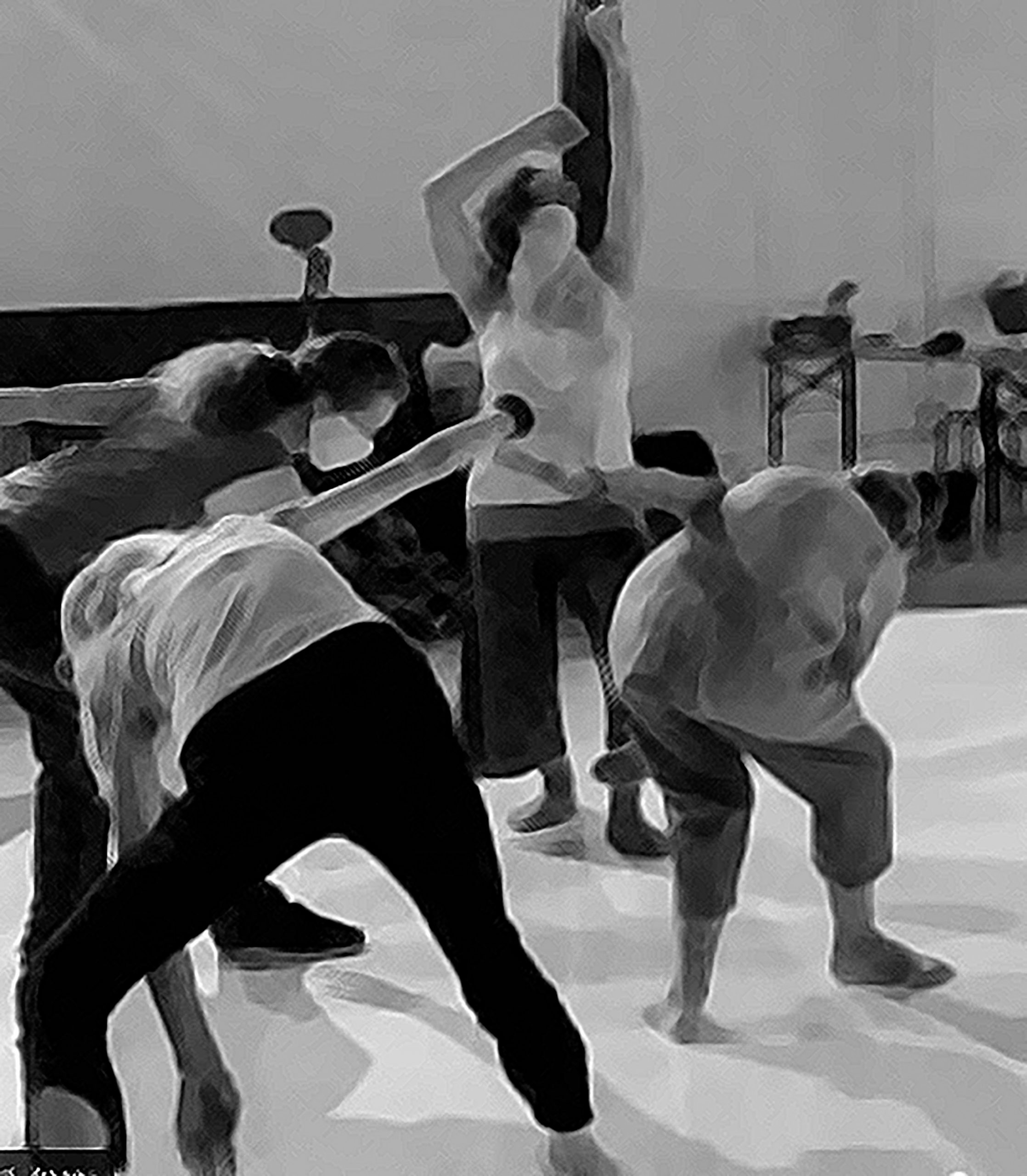 We see four dancers, captured in a black and white photograph, taking quite sculptural shapes on the white circular dance floor