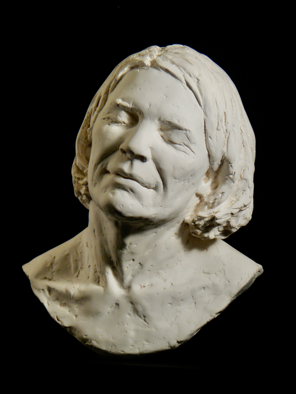 Diane Mulligan tilts her head with her eyes closed in this plaster portrait